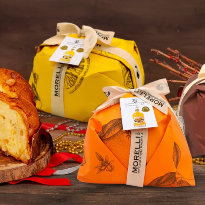 Panettones artisanaux Morelli emballés aux couleurs festives avec un panettone coupé en tranches – pâtisserie italienne traditionnelle de Toscane, photo EasyGusto.fr